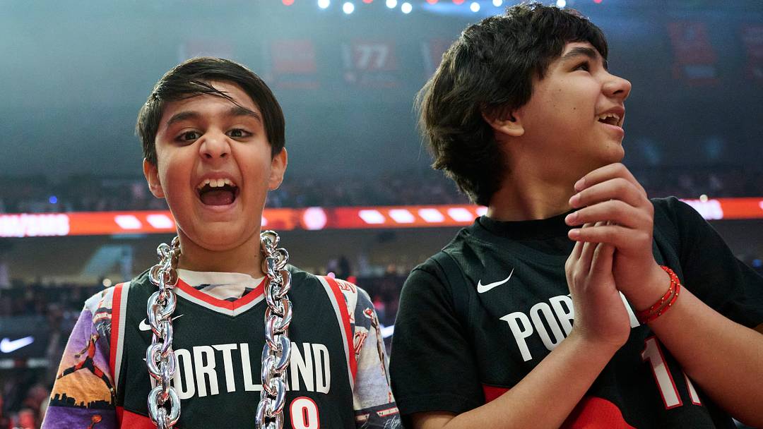 Basketball fans cheer before a game between the San Antonio Spurs and the Portland Trail Blazers during the first round of the 2026 NBA Playoffs at Moda Center. Basketball fans cheer before a game between the San Antonio Spurs and the Portland Trail Blazers during the first round of the 2026 NBA Playoffs at Moda Center.