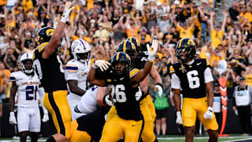Iowa Hawkeyes running back Xavier Williams (26) celebrates after scoring a touchdown against the Albany Great Danes Aug. 30, 2025 at Kinnick Stadium in Iowa City, Iowa.