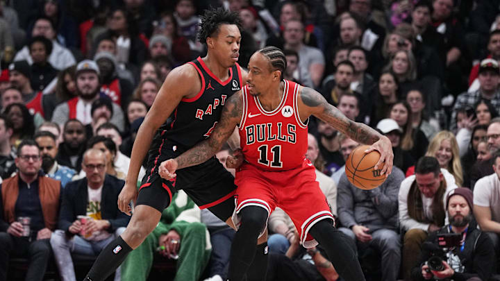 Jan 18, 2024; Toronto, Ontario, CAN; Chicago Bulls forward DeMar DeRozan (11) controls the ball as Toronto Raptors forward Scottie Barnes (4) tries to defend during the second quarter at Scotiabank Arena. Mandatory Credit: Nick Turchiaro-Imagn Images