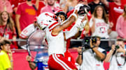 Nebraska Cornhuskers defensive back Malcolm Hartzog Jr. intercepts a pass against Cincinnati Bearcats wide receiver Caleb Goodie during the fourth quarter at GEHA Field at Arrowhead Stadium.