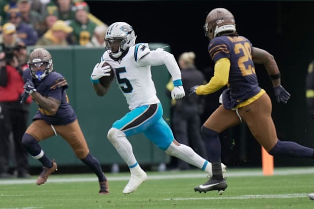 Carolina Panthers running back Rico Dowdle (5) runs for a big gain against the Packers on Sunday.