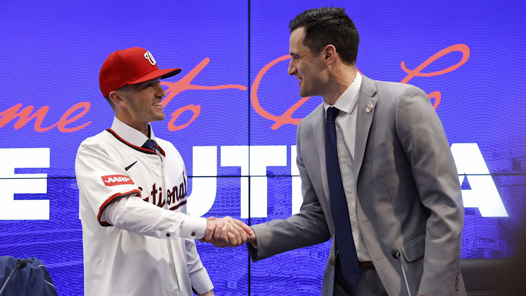 Nov 17, 2025; Washington, District of Columbia, USA;  Washington Nationals manager Blake Butera (L) shakes hands with Nationals general manager and president of baseball operations Paul Toboni (R) at an introductory press conference at Nationals Park. Mandatory Credit: Geoff Burke-Imagn Images