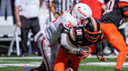 Oklahoma State Cowboys quarterback Sam Jackson V (18) fumbles the ball as he is hit by Houston Cougars linebacker Jalen Garner (36) during a college football game between the Oklahoma State Cowboys (OSU) and the Houston Cougars at Boone Pickens Stadium in Stillwater, Okla., Saturday, Oct. 11, 2025. Houston won 39-17.
