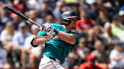 Seattle Mariners left fielder Luke Raley (20) hits a single during the seventh inning against the Los Angeles Angelsat T-Mobile Park on July 24.