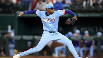 Texas Rangers pitcher Kumar Rocker (80) throws a pitch during the first inning against the Tampa Bay Rays