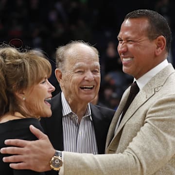 Current majority owner of the Minnesota Timberwolves Glen Taylor and his wife Becky Mulvihill greet minority owner Alex Rodriguez (right) after the team defeated the Golden State Warriors at Target Center in Minneapolis on Feb. 1, 2023.