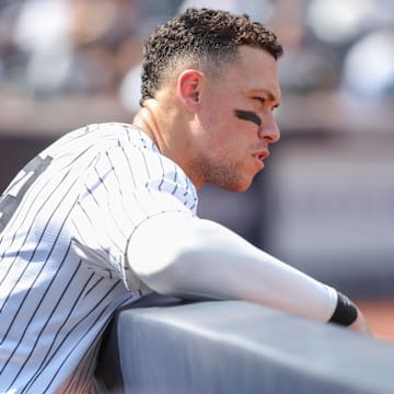Aug 10, 2025; Bronx, New York, USA;  New York Yankees designated hitter Aaron Judge (99) watches from the dugout in the fifth inning against the Houston Astros at Yankee Stadium. Mandatory Credit: Wendell Cruz-Imagn Images