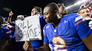 Nov 16, 2024; Gainesville, Florida, USA; Florida Gators quarterback DJ Lagway (2) gestures towards a sign held by Florida Gators offensive lineman Austin Barber (58) after a game against the LSU Tigers at Ben Hill Griffin Stadium. Mandatory Credit: Matt Pendleton-Imagn Images