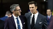 Feb 9, 2025; New Orleans, LA, USA; Fox Sports announcer Kevin Burkhardt (left) with Tom Brady on the field before Super Bowl LIX between the Philadelphia Eagles and the Kansas City Chiefs at Ceasars Superdome. Mandatory Credit: Mark J. Rebilas-Imagn Images