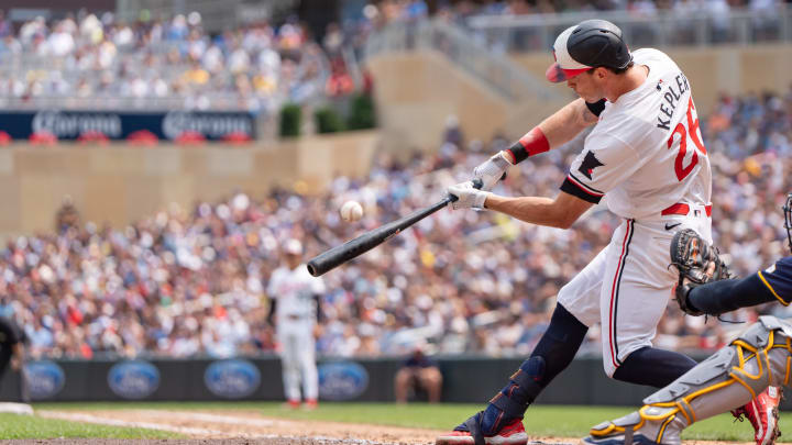 Jul 21, 2024; Minneapolis, Minnesota, USA; Minnesota Twins right field Max Kepler (26) connects in the fifth inning against the Milwaukee Brewers at Target Field. Mandatory Credit: Matt Blewett-USA TODAY Sports