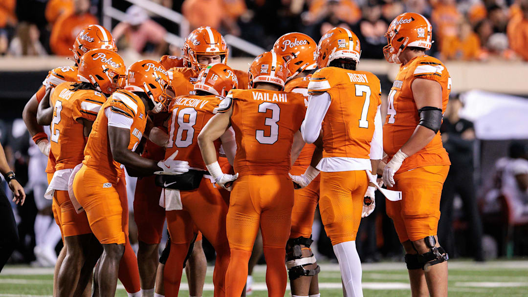 Oct 18, 2025; Stillwater, Oklahoma, USA; Oklahoma State Cowboys huddle during the second half against the Cincinnati Bearcats at Boone Pickens Stadium. Mandatory Credit: William Purnell-Imagn Images