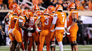 Oct 18, 2025; Stillwater, Oklahoma, USA; Oklahoma State Cowboys huddle during the second half against the Cincinnati Bearcats at Boone Pickens Stadium. Mandatory Credit: William Purnell-Imagn Images