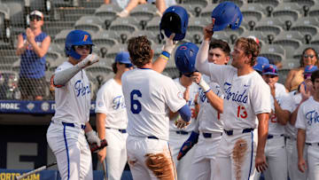 May 20, 2025; Hoover, AL, USA; Florida shortstop Bobby Boser (6) is congratulated at the plate after hitting a homer against South Carolina in the first round of the SEC Baseball Tournament at the Hoover Met.