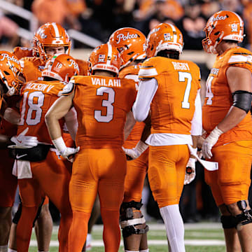 Oct 18, 2025; Stillwater, Oklahoma, USA; Oklahoma State Cowboys huddle during the second half against the Cincinnati Bearcats at Boone Pickens Stadium. Mandatory Credit: William Purnell-Imagn Images