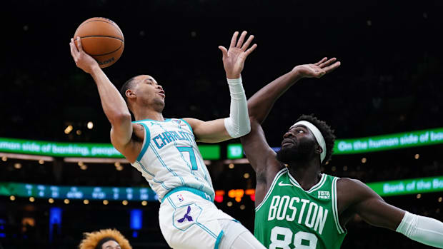 Boston Celtics Center Neemias Queta (88) defends against Charlotte Hornets Bryce McGowens (7)