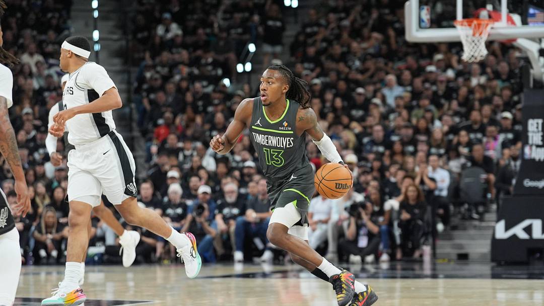 May 6, 2026; San Antonio, Texas, USA; Minnesota Timberwolves guard Ayo Dosunmu (13) dribbles in the first half against the San Antonio Spurs during game two of the second round of the 2026 NBA Playoffs at Frost Bank Center. Mandatory Credit: Daniel Dunn-Imagn Images