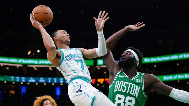 Apr 12, 2024; Boston, Massachusetts, USA; Boston Celtics center Neemias Queta (88) defends against Charlotte Hornets guard Bryce McGowens (7) in the second half at TD Garden. Apr 12, 2024; Boston, Massachusetts, USA; Boston Celtics center Neemias Queta (88) defends against Charlotte Hornets guard Bryce McGowens (7) in the second half at TD Garden.