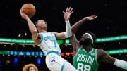 Apr 12, 2024; Boston, Massachusetts, USA; Boston Celtics center Neemias Queta (88) defends against Charlotte Hornets guard Bryce McGowens (7) in the second half at TD Garden.