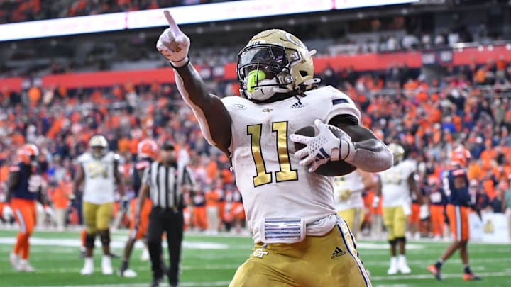 Sep 7, 2024; Syracuse, New York, USA; Georgia Tech Yellow Jackets running back Jamal Haynes (11) scores a touchdown against the Syracuse Orange in the fourth quarter at the JMA Wireless Dome. Mandatory Credit: Mark Konezny-Imagn Images