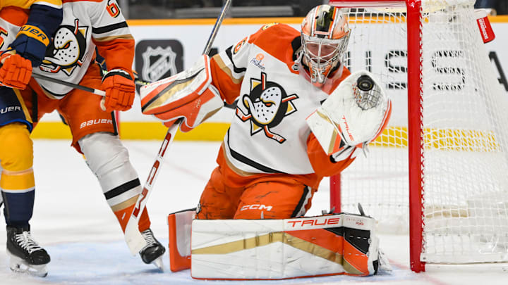 Mar 20, 2025; Nashville, Tennessee, USA;  Anaheim Ducks goaltender John Gibson (36) makes a glove save against the Nashville Predators during the third period at Bridgestone Arena. Mandatory Credit: Steve Roberts-Imagn Images