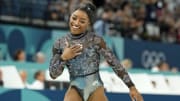 Jul 28, 2024; Paris, France; Simone Biles of the United States reacts after performing on the beam in women's qualification during the Paris 2024 Olympic Summer Games at Bercy Arena. 