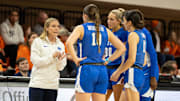 Jan 17, 2024; Stillwater, Okla, USA; BYU Cougars head coach Amber Whiting talks with guard Kailey Woolston (10), guard Kaylee Smiler (11), forward Rose Bubakar (24) and guard Lauren Davenport (30) in the first half of a women  s NCAA basketball game against the Oklahoma State Cowgirls at Gallagher Iba Arena. Mandatory Credit: Mitch Alcala-The Oklahoman