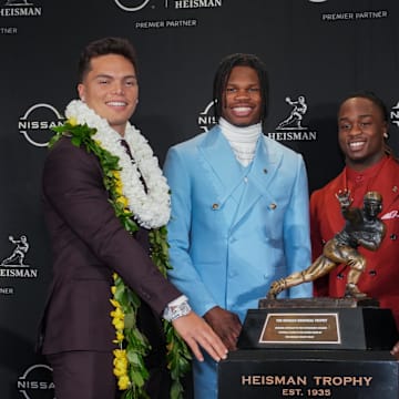 Dec 14, 2024; New York, NY, USA; From left, Heisman Trophy nominees Oregon Ducks quarterback Dillon Gabriel, Colorado Buffaloes wide receiver/cornerback Travis Hunter, Boise State Broncos running back Ashton Jeanty and Miami Hurricanes quarterback Cam Ward pose for a photo during a press conference before the 2024 Heisman Trophy Presentation. Mandatory Credit: Lucas Boland-Imagn Images