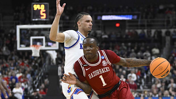 Razorbacks guard Johnell Davis (1) drives to the basket during the second half against Kansas at Amica 