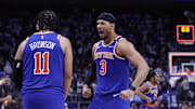 New York Knicks guards Jalen Brunson and Josh Hart celebrate after beating the Detroit Pistons during the 2024 NBA Playoffs 