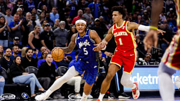 Atlanta Hawks star forward Jalen Johnson defending Orlando Magic star Paolo Banchero.