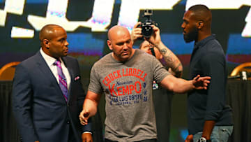 UFC president Dana White separates fighter Jon Jones from Daniel Cormier during a press conference prior to weigh-ins for UFC 196 at MGM Grand Garden Arena. 