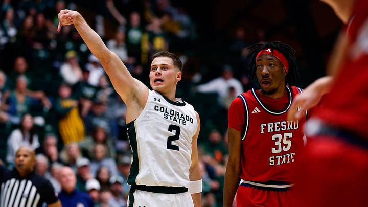 Feb 24, 2026; Fort Collins, Colorado, USA; Colorado State Rams guard Brandon Rechsteiner (2) watches his shot with Fresno State Bulldogs forward Deshawn Gory (35) in the second half at Moby Arena. Mandatory Credit: Isaiah J. Downing-Imagn Images