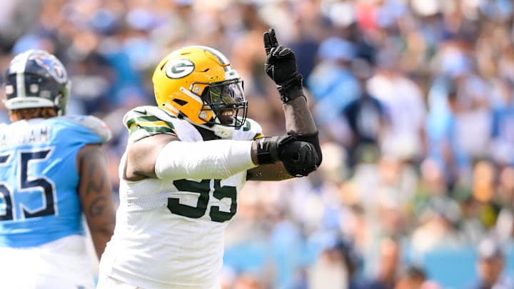 Sep 22, 2024; Nashville, Tennessee, USA;  Green Bay Packers defensive tackle Devonte Wyatt (95) celebrates his sack of Tennessee Titans quarterback Will Levis (8) during the second half at Nissan Stadium. Mandatory Credit: Steve Roberts-Imagn Images