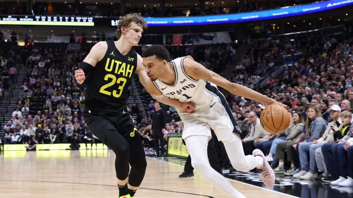 Mar 27, 2024; Salt Lake City, Utah, USA; San Antonio Spurs center Victor Wembanyama (1) drives against Utah Jazz forward Lauri Markkanen (23) during the fourth quarter at Delta Center. Mandatory Credit: Rob Gray-USA TODAY Sports