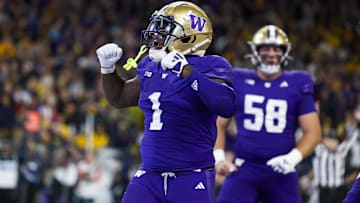 Oct 5, 2024; Seattle, Washington, USA; Washington Huskies running back Jonah Coleman (1) celebrates after rushing for a touchdown against the Michigan Wolverines during the fourth quarter at Alaska Airlines Field at Husky Stadium. Mandatory Credit: Joe Nicholson-Imagn Images