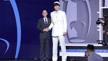  Yang Hansen stands with NBA commissioner Adam Silver after being selected as the 16th pick by the Memphis Grizzlies in the first round of the 2025 NBA Draft at Barclays Center. 