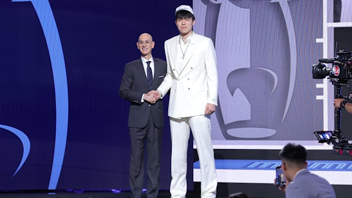 Yang Hansen stands with NBA commissioner Adam Silver after being selected as the 16th pick by the Memphis Grizzlies in the first round of the 2025 NBA Draft at Barclays Center. Yang Hansen stands with NBA commissioner Adam Silver after being selected as the 16th pick by the Memphis Grizzlies in the first round of the 2025 NBA Draft at Barclays Center.