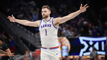Mar 12, 2025; Kansas City, MO, USA; Kansas Jayhawks center Hunter Dickinson (1) reacts after a play during overtime against the UCF Knights at T-Mobile Center. 