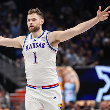 Mar 12, 2025; Kansas City, MO, USA; Kansas Jayhawks center Hunter Dickinson (1) reacts after a play during overtime against the UCF Knights at T-Mobile Center.
