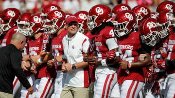 Oklahoma coach Brent Venables walks with his team before a college football game between the University of Oklahoma Sooners (OU) and the Arkansas State Red Wolves at Gaylord Family-Oklahoma Memorial Stadium in Norman, Okla., Saturday, Sept. 2, 2023.