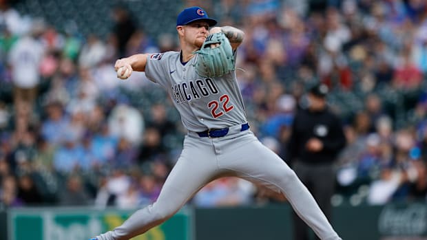 Horton getting ready to release a ball out of a blue glove in a solid grey unifor