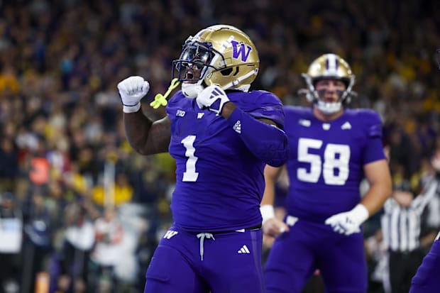Washington Huskies running back Jonah Coleman (1) celebrates after rushing for a touchdown.