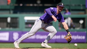 May 4, 2025; San Francisco, California, USA; Colorado Rockies second baseman Kyle Farmer (6) fields a ground ball against the San Francisco Giants during the eighth inning at Oracle Park. Mandatory Credit: Robert Edwards-Imagn Images