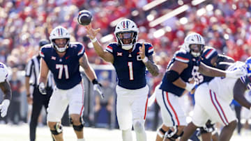 Nov 8, 2025; Tucson, Arizona, USA; Arizona Wildcats quarterback Noah Fifita (1) throws a touchdown pass against the Kansas Jayhawks in the first half at Arizona Stadium. Mandatory Credit: Mark J. Rebilas-Imagn Images