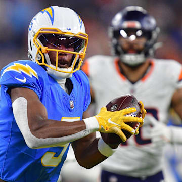 Dec 19, 2024; Inglewood, California, USA; Los Angeles Chargers wide receiver Joshua Palmer (5) runs the ball against the Denver Broncos during the first half at SoFi Stadium. 