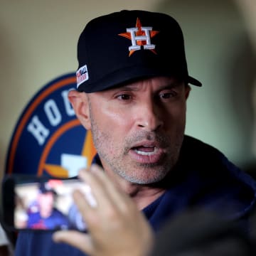 Jun 15, 2024; Houston, Texas, USA; Houston Astros manager Joe Espada (19) talks to the media in the dugout prior to the game against the Detroit Tigers at Minute Maid Park.