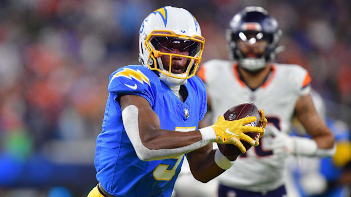 Dec 19, 2024; Inglewood, California, USA; Los Angeles Chargers wide receiver Joshua Palmer (5) runs the ball against the Denver Broncos during the first half at SoFi Stadium.