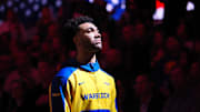 Golden State Warriors forward Trayce Jackson-Davis (32) during the national anthem before the game against the Denver Nuggets at Chase Center.