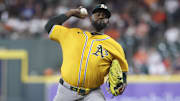Jul 24, 2025; Houston, Texas, USA;  Athletics starting pitcher Luis Severino (40) delivers a pitch during the second inning against the Houston Astros at Daikin Park. Mandatory Credit: Troy Taormina-Imagn Images