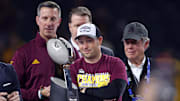 Arizona State Sun Devils head coach Kenny Dillingham looks at the trophy after winning the Big 12 Championship game.